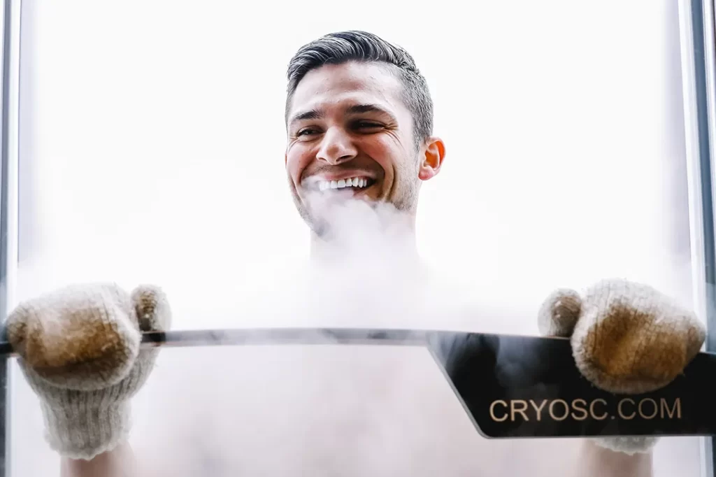 Smiling man with winter gloves on his hands during the Cryotherapy session