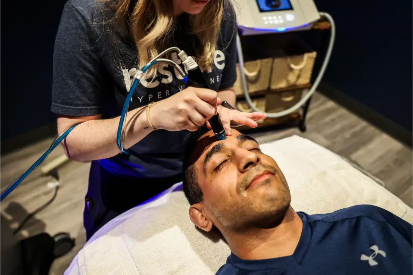 Man laying down during a hydrafacial.